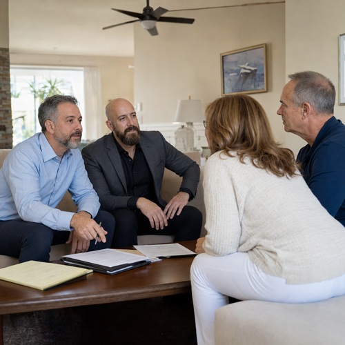 Michael Ligon and David Ligon discussing a cash offer with a couple in Brevard County